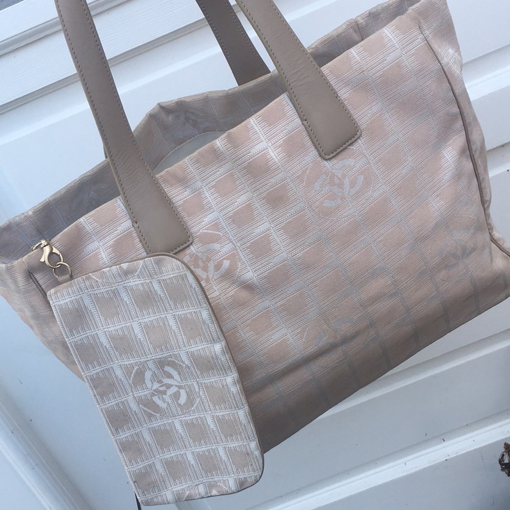 Authentic Chanel Travel Line Tote in good condition with pouch